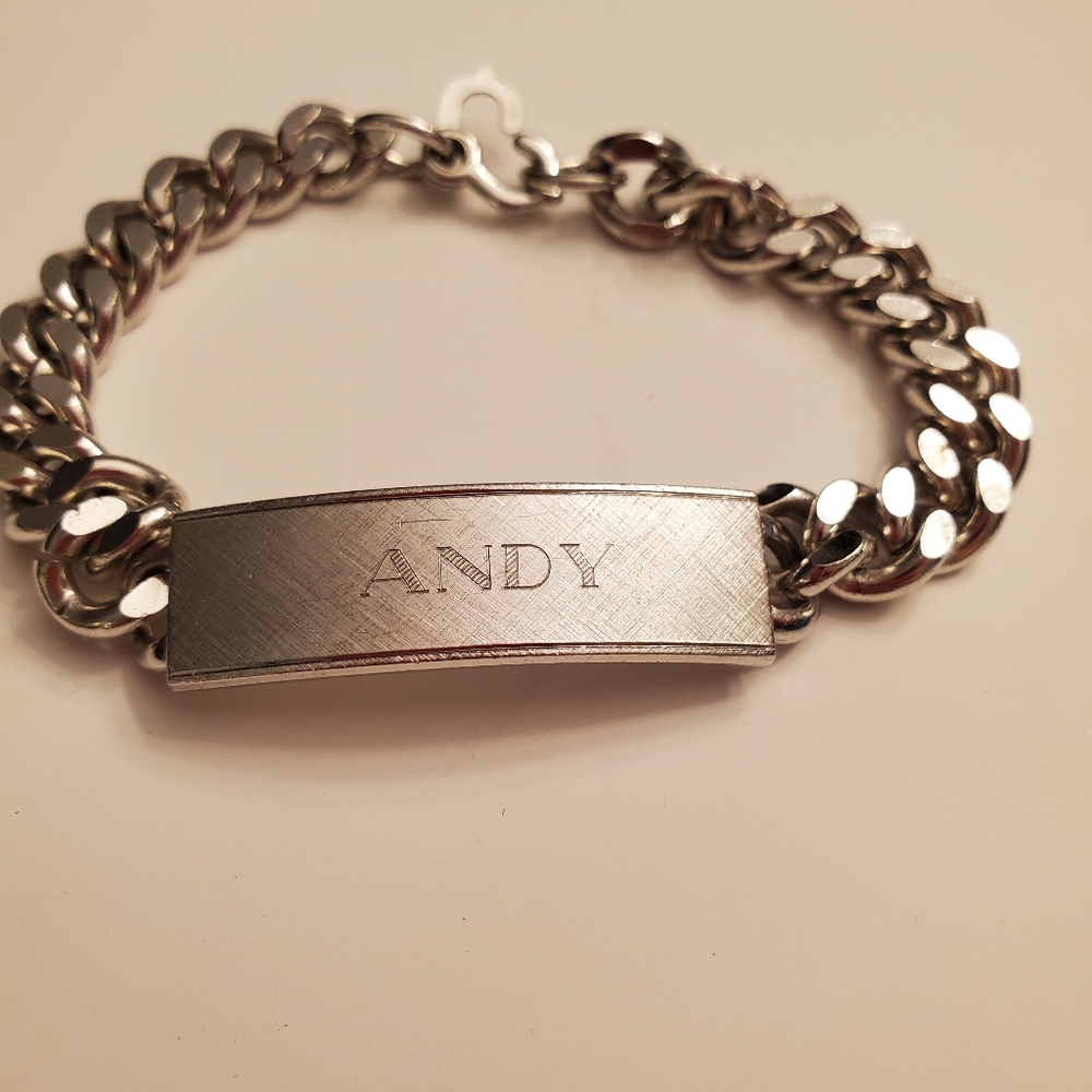 STAINLESS STEEL BRACLET WITH ANDY engraved.